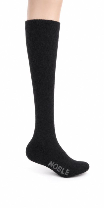 Noble Socks alpaca boot sock - black, on foot