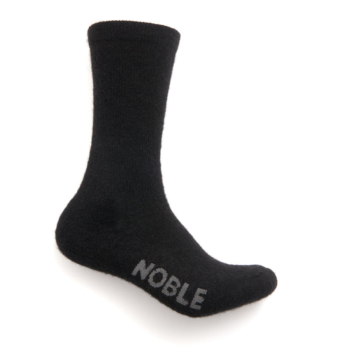 Noble Socks alpaca crew sock - black, on foot